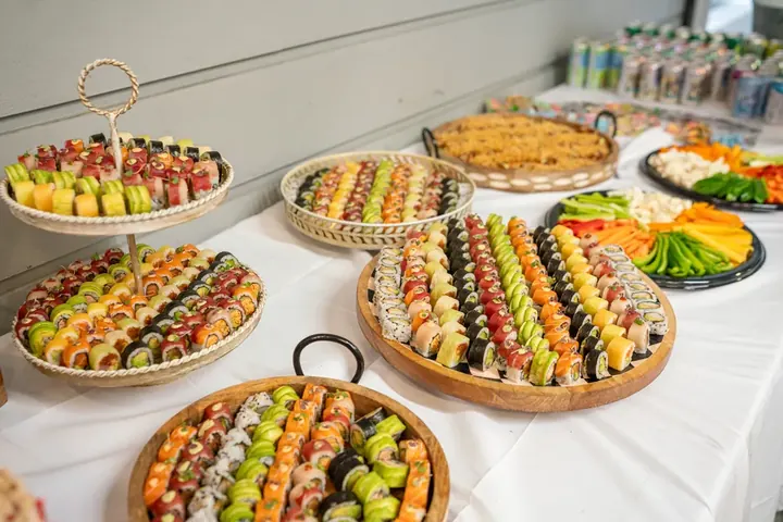 Elaborate sushi and appetizer spread at a conference kosher reception